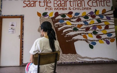 December 2 2015 - The Women’s Centre: Kamiela sits at the entrance to the Women’s Centre in front of her favourite mural. The Saartjie Baartman Centre for Women and Children, based in Klipfontein Road in Manenberg, is a one-stop centre for women & children who are survivors of abuse; Kamiela has been living at the safe haven for six months partcipating in the kitchen program as part of her ongoing care. Picture by David Harrison